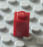 replacement dark red / maroon Lego brick.