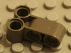 Dark old grey Technic Lego part.