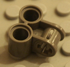 Dark old grey Technic Lego part.