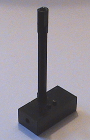 black Lego brick with turn shaft